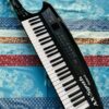 Clavier synthé portable Roland AX-Synth n°Z1D4407, sangle Roland, alim